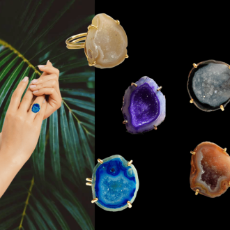 Hand wearing a blue druzy gemstone ring with palm leaves in the background.